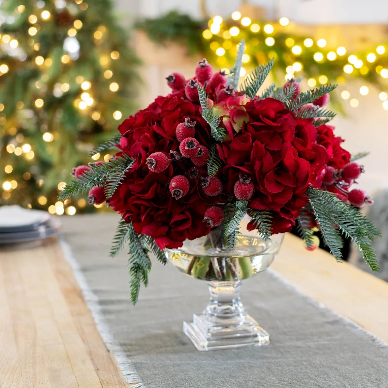 Holiday Cheer - Red Hydrangea, Real Touch Pine, & Iced Rosehip Berry Water Illusion Holiday Christmas Arrangement in Luxury Footed Glass Bowl